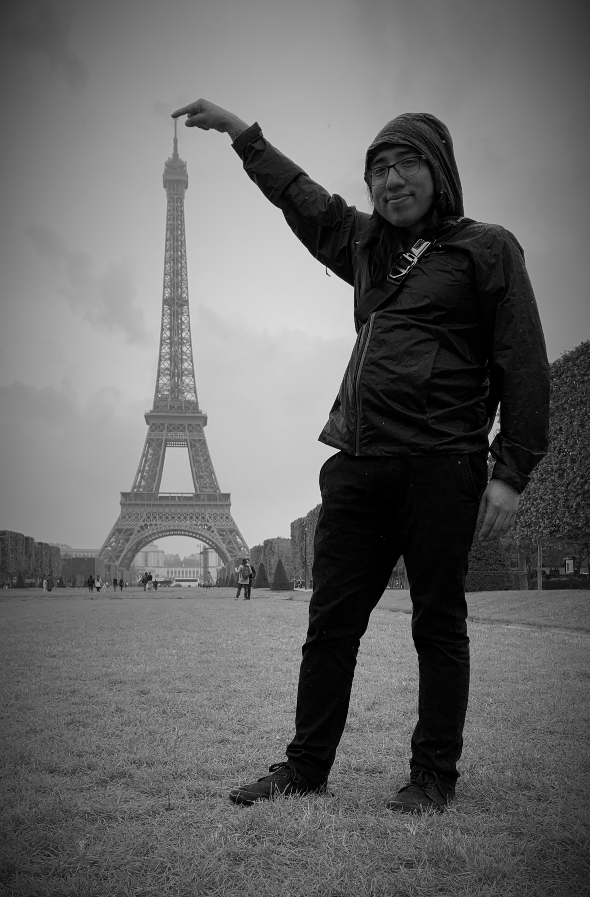 Isaac touching the top of the effel tower